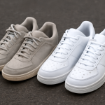 deux paires de baskets differents styles sur bitume